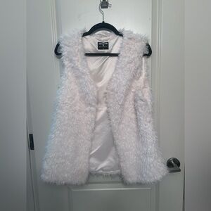 Woman’s off white faux fur vest
